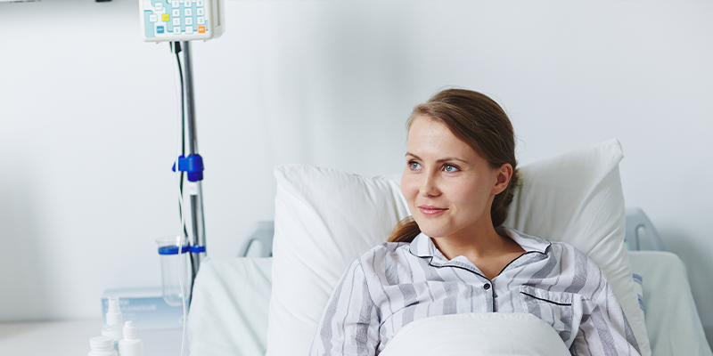 DME Hospital Bed with a Smiling Female Patient