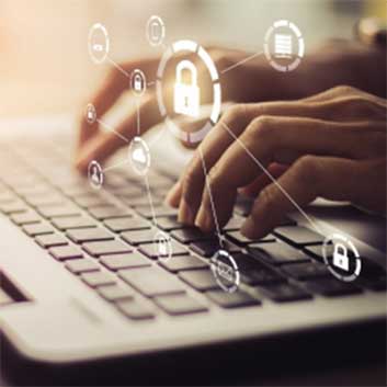 hands on a laptop keyboard with security icon overlays as an effect