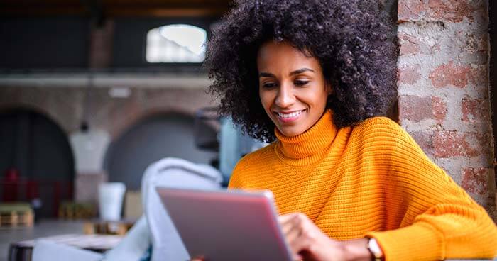 Woman in cafe using tablet