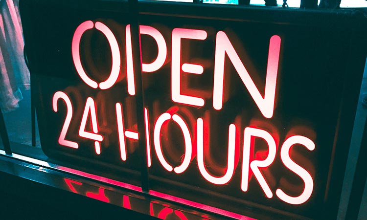 Neon sign stating Open 24 Hours