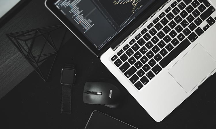Laptop with source code on screen