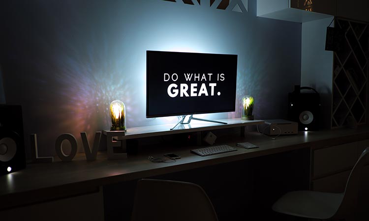 backlit computer screen with on-screen do what is great text